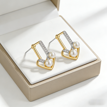 🔺 “Architectural Akoya Triad” – Geometric Artistry | Interlocking Gold & Silver-Tone V-Shapes × Channel-Set Shimmer × Two Matched Pearl Spire 🏛️